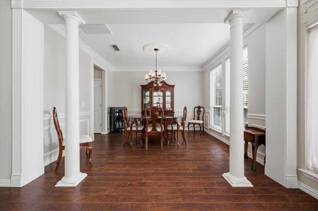 Right side as you enter the home with columns and light