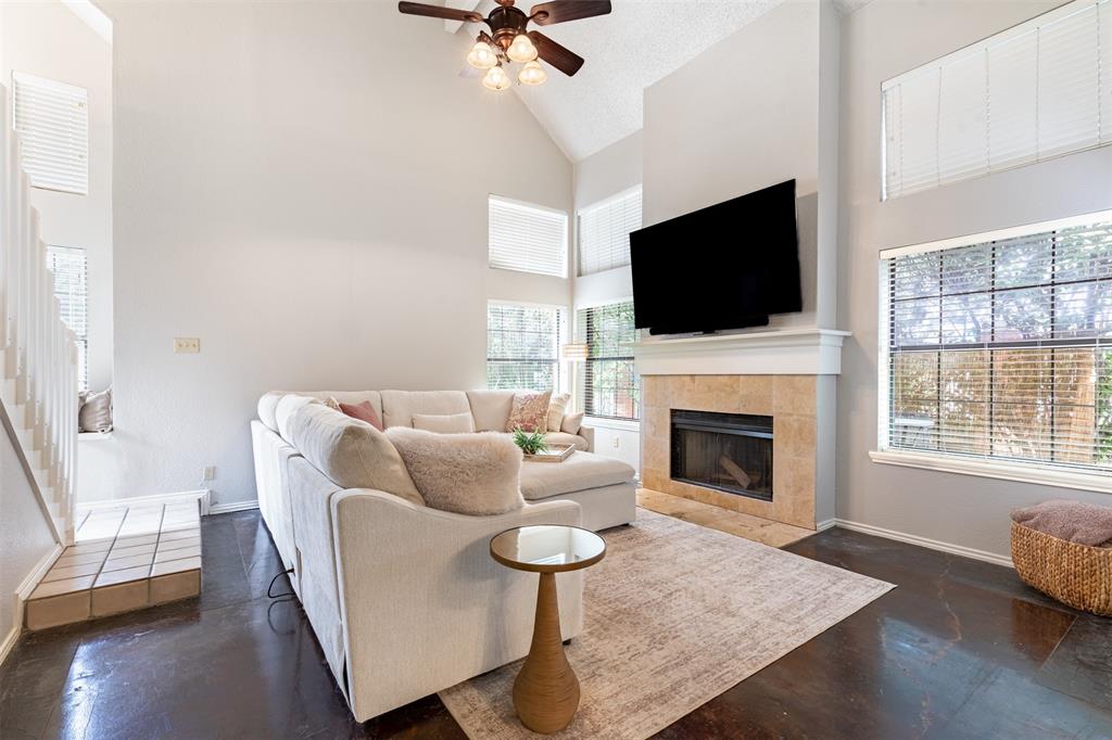 Two story family room with fireplace for cozy nights in.