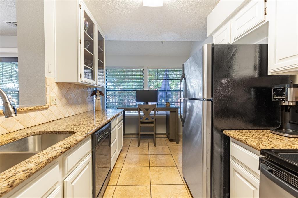 Large kitchen with stainless appliances