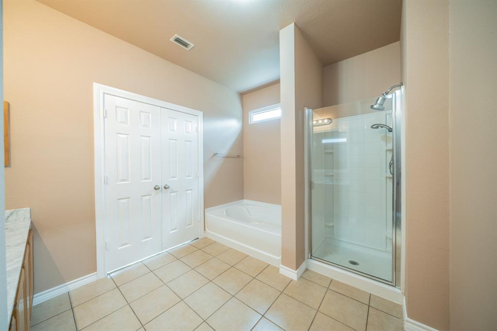 Master bath, large garden tub and separate shower.