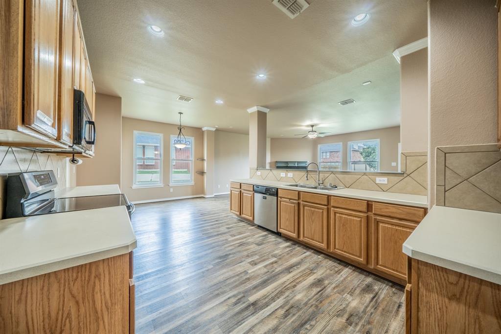 Kitchen from hallway looking towards breakfast nook. Kitchen from hallway looking towards breakfast nook.