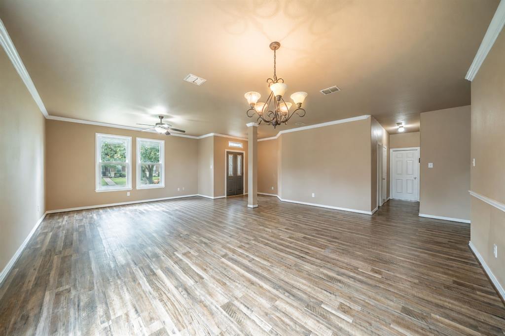 Formal dining room looking toward formal living area and front door.