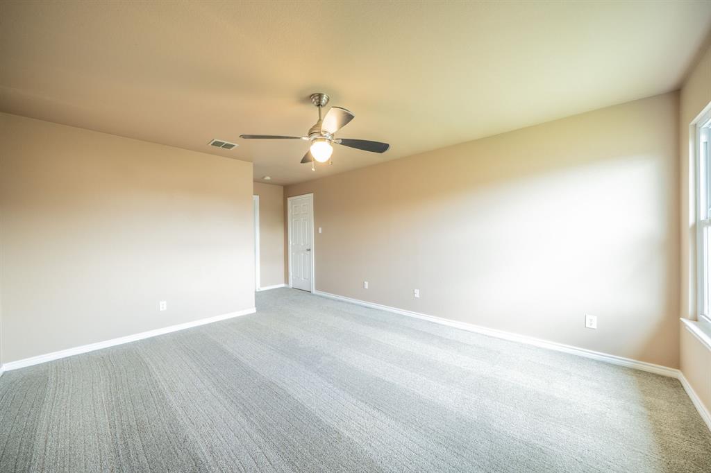 Second upstairs bedroom with ceiling fans.