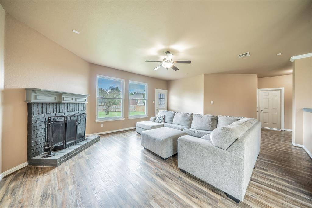 Family room with fireplace, mantle, hearth, fireplace tools and screen. Family room with fireplace, mantle, hearth, fireplace tools and screen.