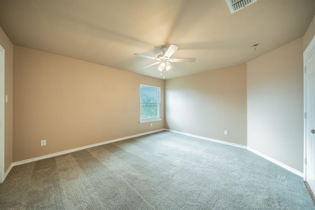 Third upstairs bedroom with ceiling fan.