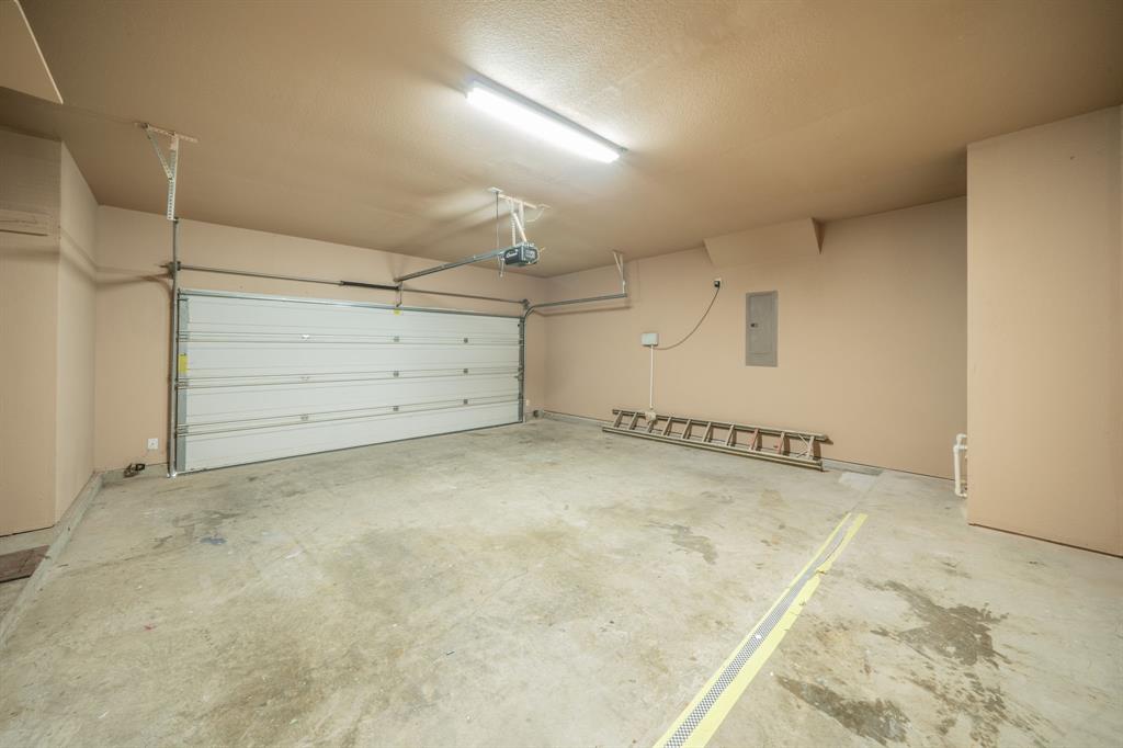 Two car garage that is 22 feet deep and 20 feet wide with 7 feet by 2 feet storage area to the left in this photo.