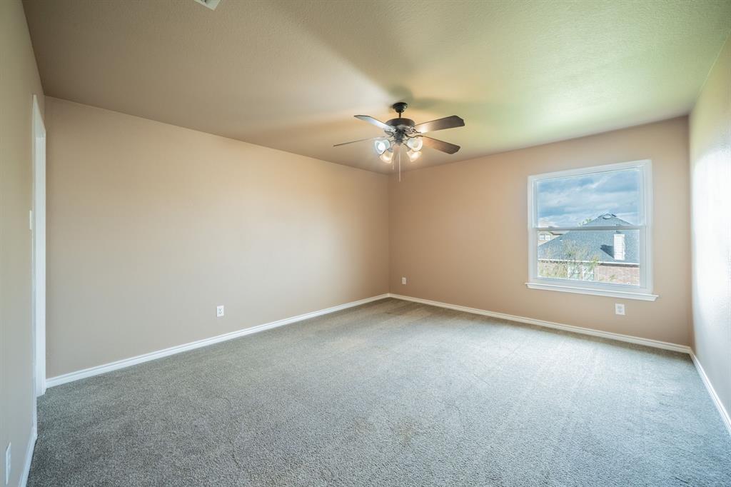 Third upstairs bedroom with ceiling fan.