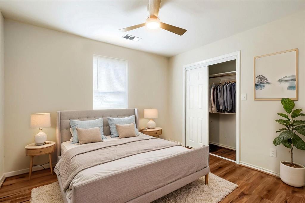 Virtually Staged. Laminate wood-finish flooring, recessed ceiling fan with integrated lighting, and a closet with sliding paneled doors Virtually Staged. Laminate wood-finish flooring, recessed ceiling fan with integrated lighting, and a closet with sliding paneled doors