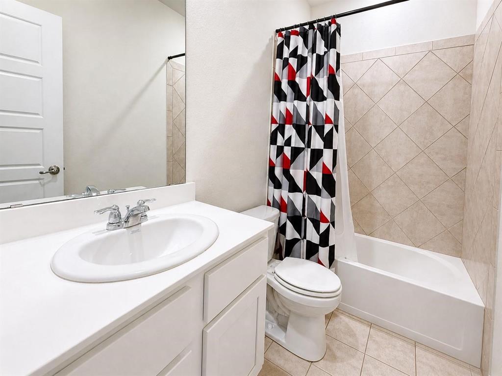 Secondary, full bathroom with vanity and shower-tub combo