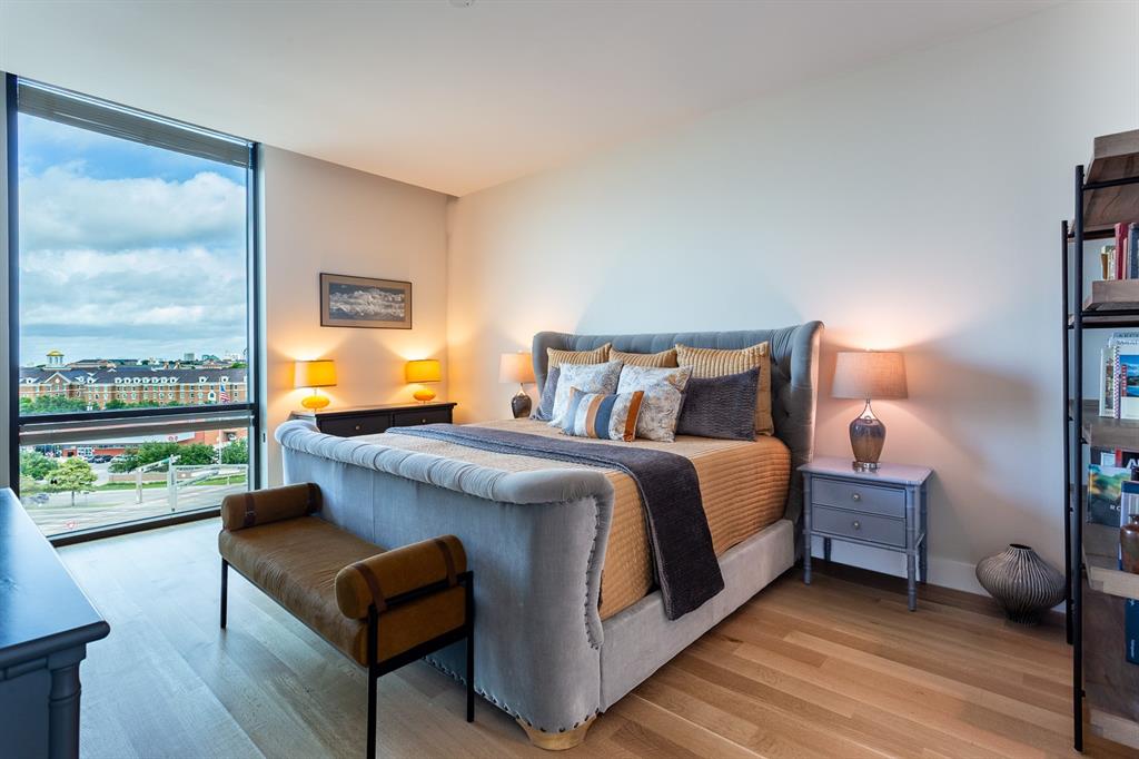 Large Primary Bedroom with wood floors.
