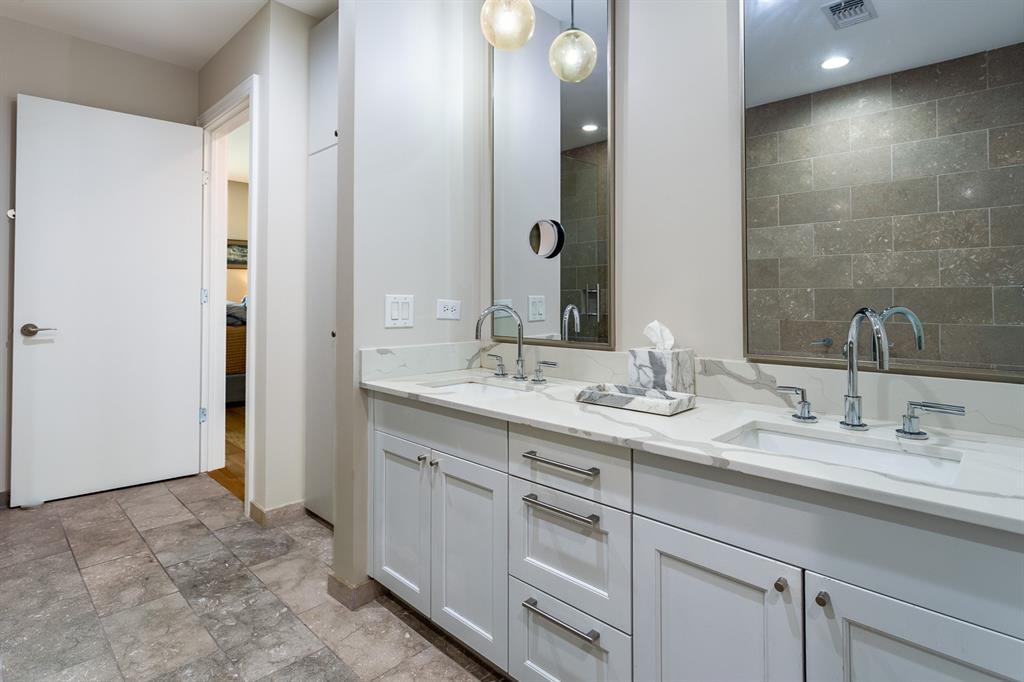 Double vanity with quartz counters & Dornbracht fixtures.