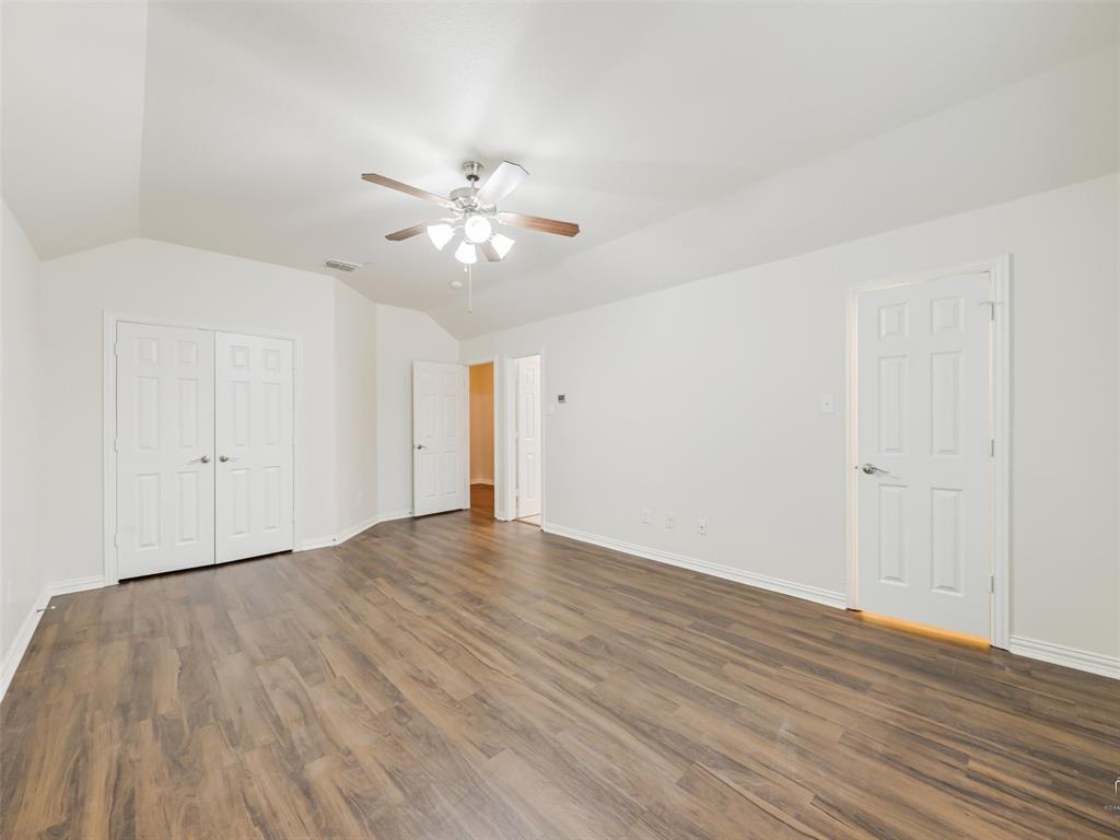 Another view of the primary bedroom with 2 closets