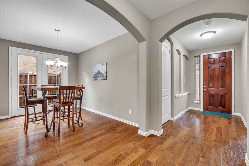 Engineered hardwood floors flow from the front door through the dining and main living areas.