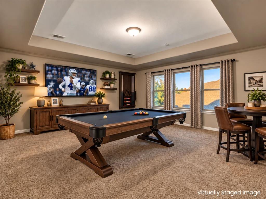 Virtually staged to show this as a true game room. The stair well is 40-inches wide so it would be easy to get a pool table up here.