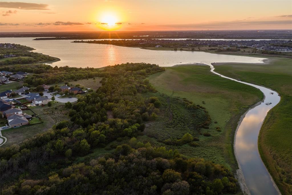 Enjoy evening sunsets views while sitting out front Peaceful living in the heart of the booming northern DFW Metroplex.