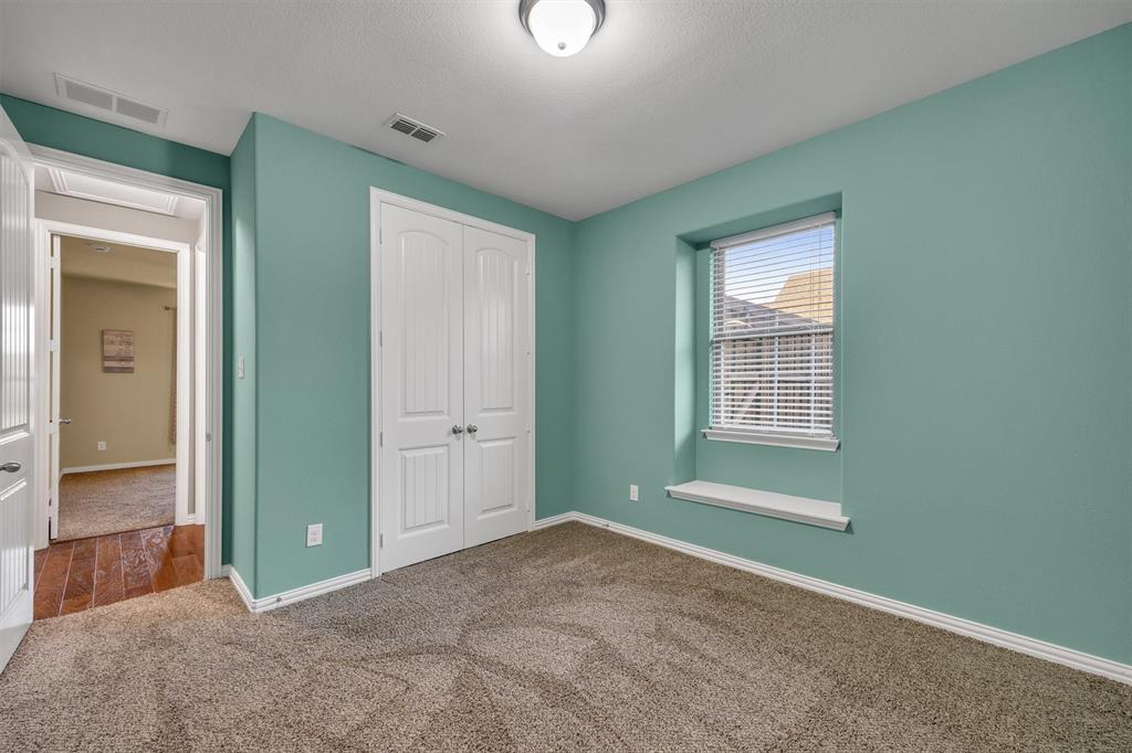 Smaller of the two secondary bedrooms.