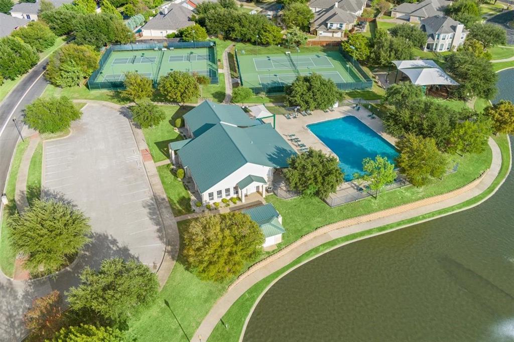 View of community club house, pool, pickleball and tennis courts