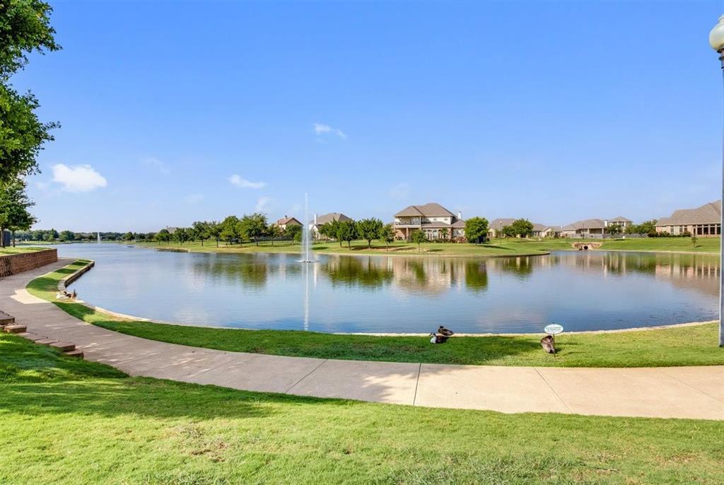 View of community lake with walking path