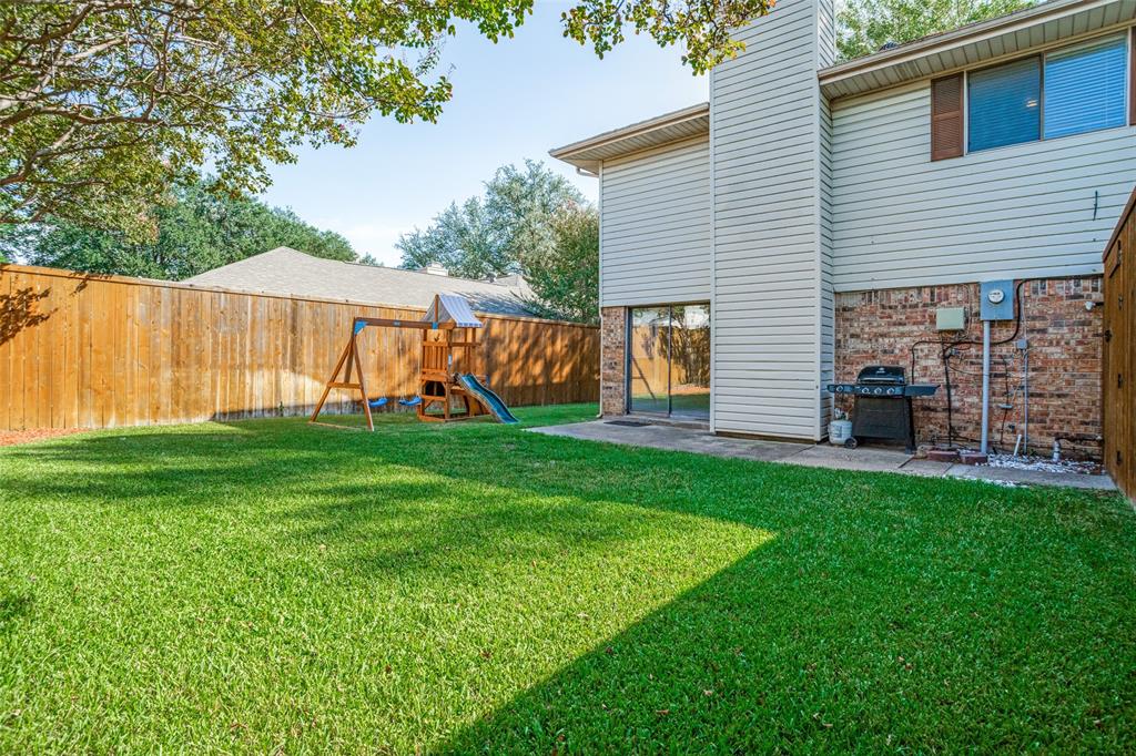Large back yard with play scape.