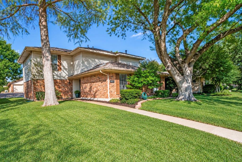 Large front yard with great shade trees.