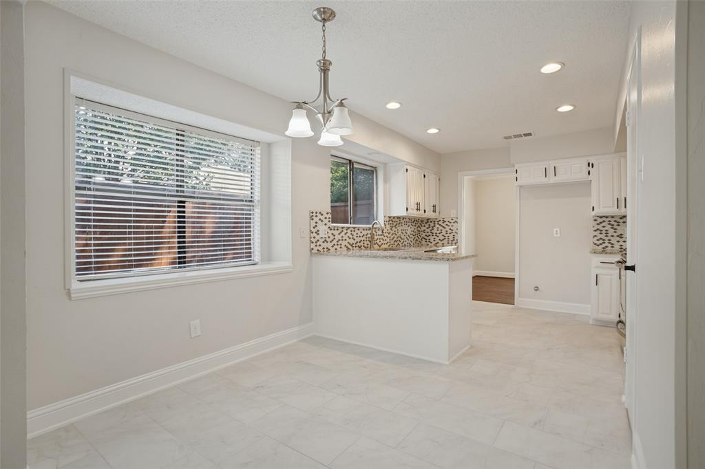 Breakfast area and kitchen, new porcelain tile floors.
