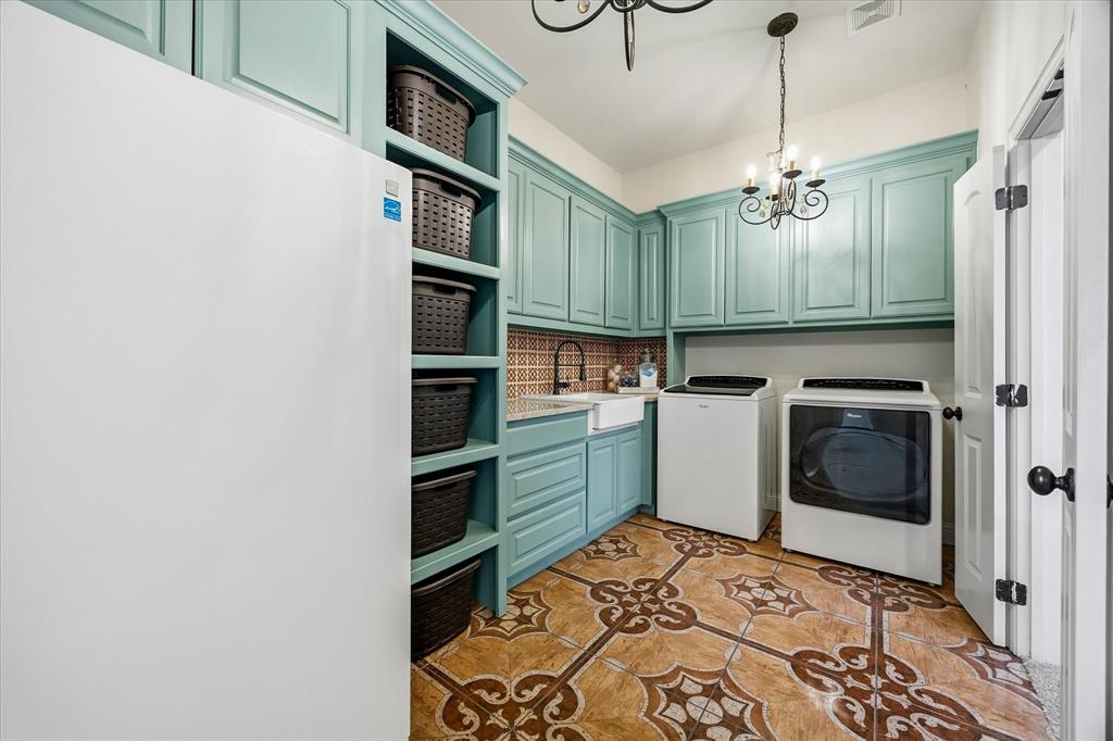 Expansive laundry room includes ample cabinetry!