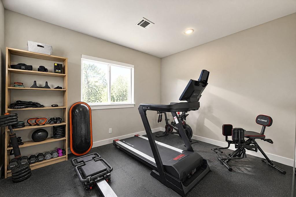 Stay on top of health goals without leaving home in this upstairs gym