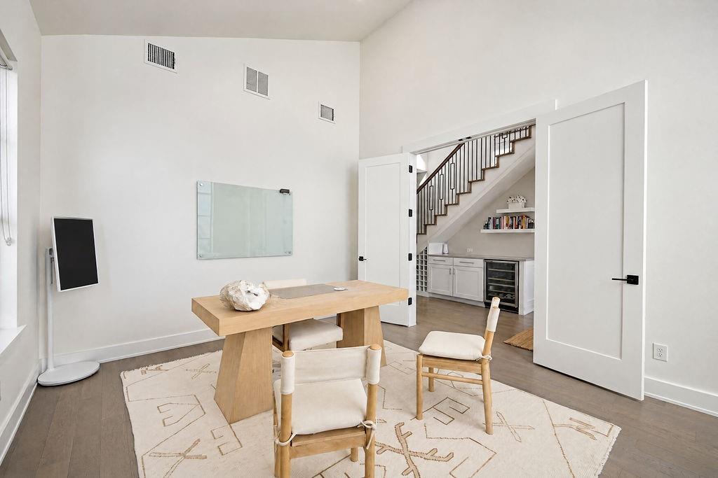 Natural sunlight pours across the main-floor office, creating an inspiring spot to work from home or host virtual meetings