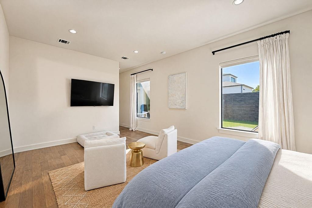Enjoy restful nights and bright mornings in a primary suite positioned quietly at the back of the home