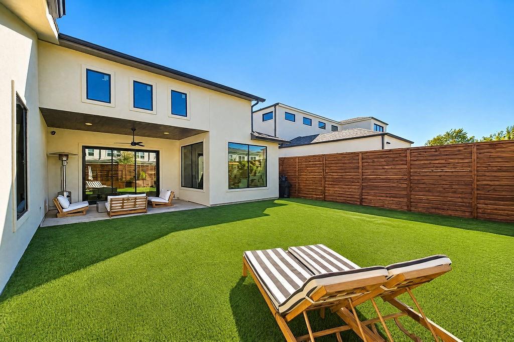 Turf grass keeps the private backyard looking lush and green 365 days a year with zero lawnmowers required