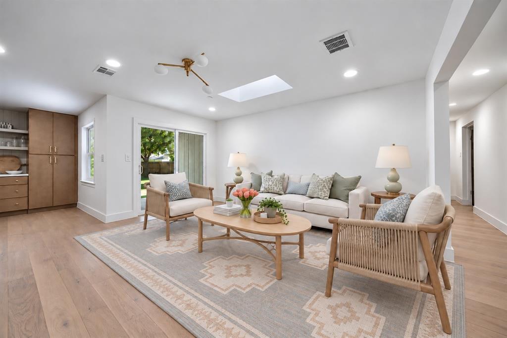 The living space also opens directly to the backyard, extending entertaining outdoors. (This photo has been digitally enhanced.)