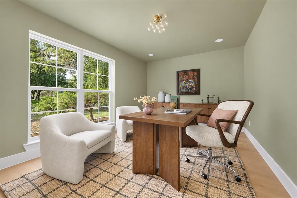 This beautifully appointed home office provides an ideal setting for working from home. It can also be used as another bedroom. (This photo has been digitally enhanced.)