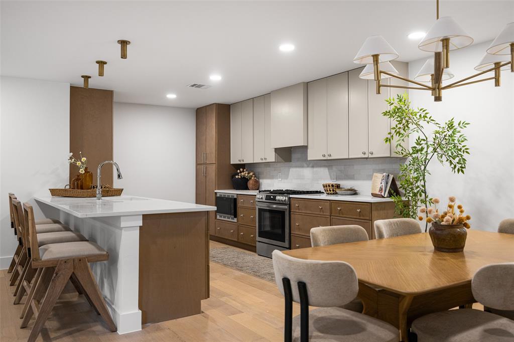 The open kitchen and dining area creates an inviting space for gathering with family and friends.
