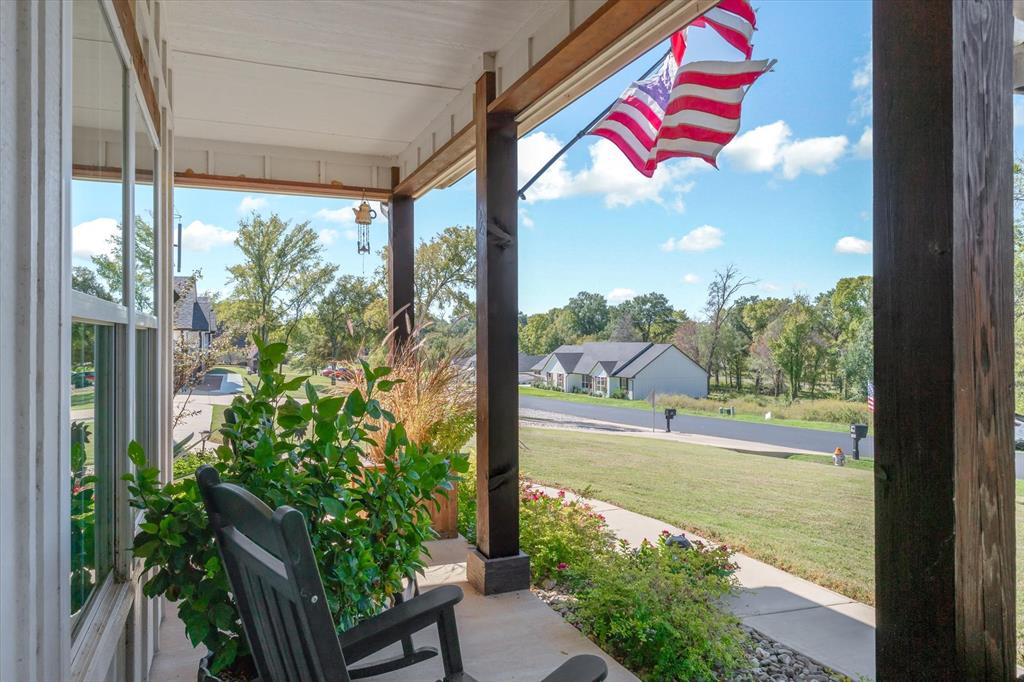 Covered front porch featuring exposed timber posts and a concrete floor Covered front porch featuring exposed timber posts and a concrete floor