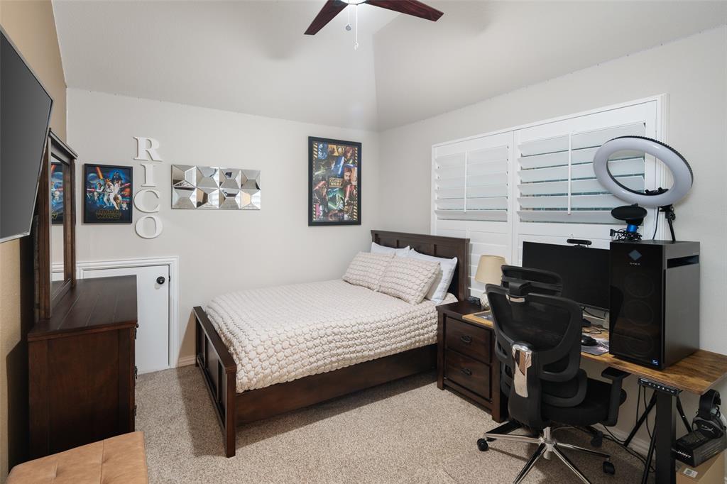 Vaulted ceiling, ceiling fan, and plantation shutters