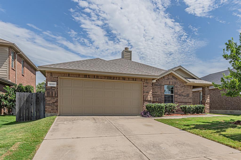 Brick exterior with a prominent two-car garage