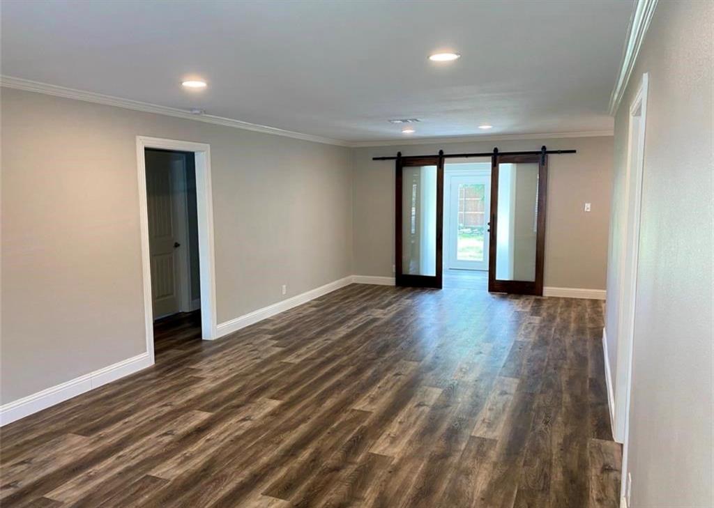 Great room / Living & Dining combination. View from front door and barn doors enter bonus space Great room / Living & Dining combination. View from front door and barn doors enter bonus space