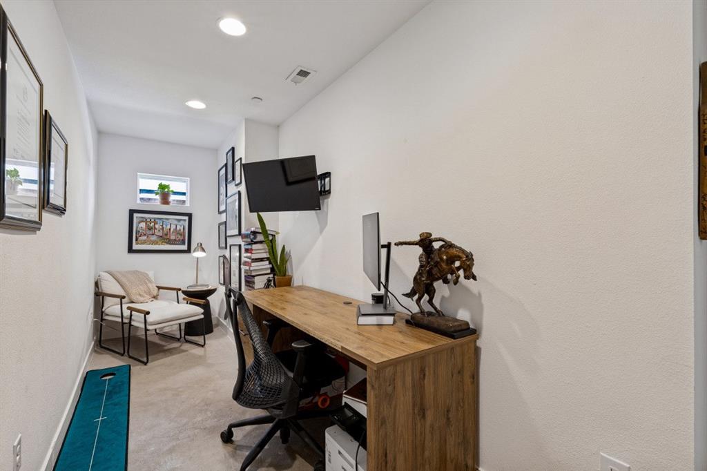 Interior space featuring recessed lighting and a high-set rectangular window