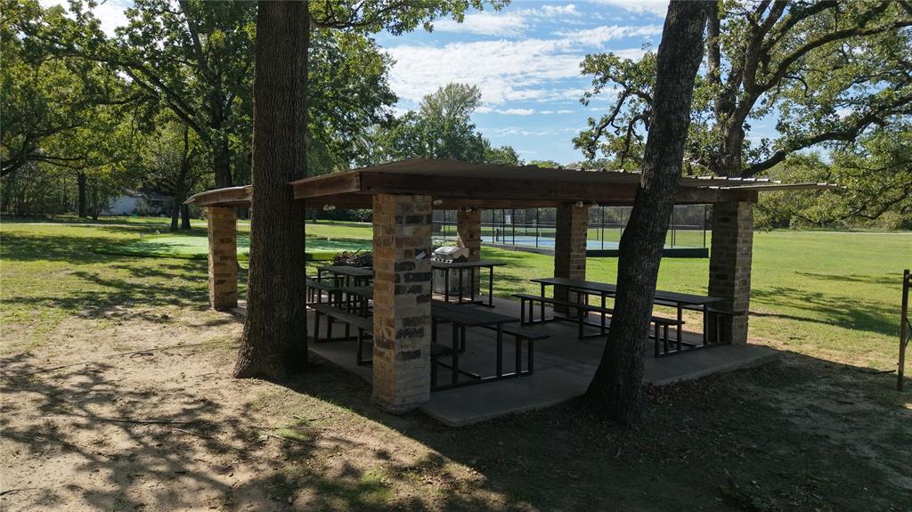 Community picnic pavilion with shaded seating and grilling area.