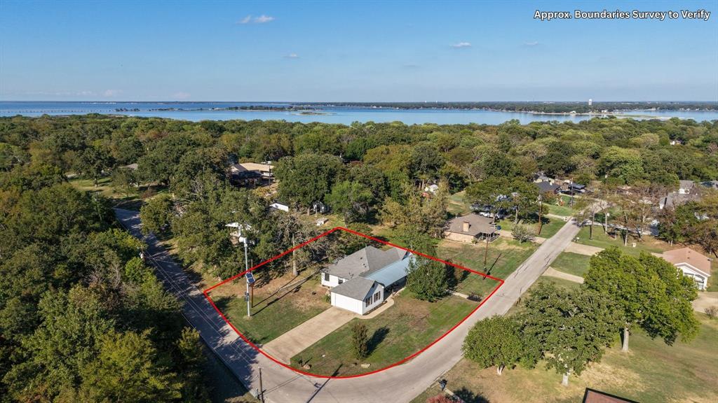 Aerial view showcasing the home's location near Cedar Creek Lake.