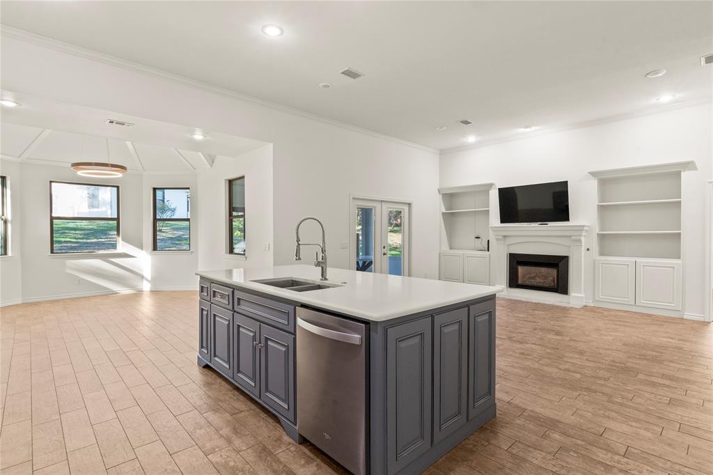 Spacious open floor plan connecting the kitchen, living area, and dining room. Spacious open floor plan connecting the kitchen, living area, and dining room.
