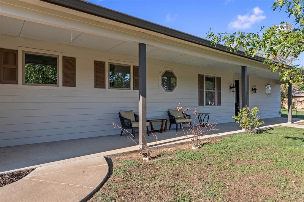 Expansive covered front porch offering plenty of room for outdoor seating. Expansive covered front porch offering plenty of room for outdoor seating.