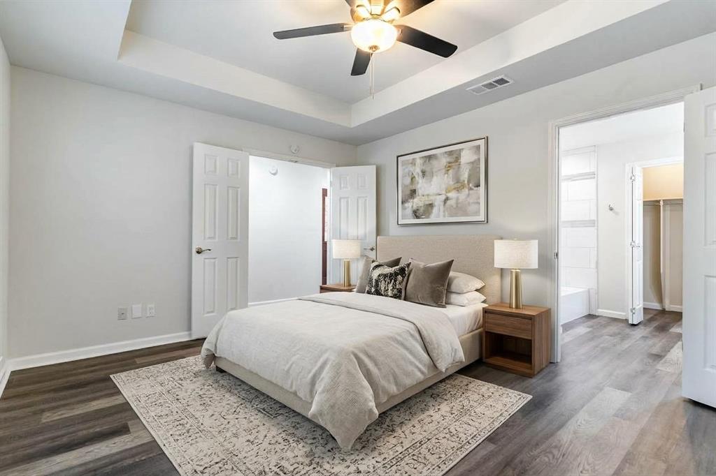 Primary bedroom with vaulted ceilings