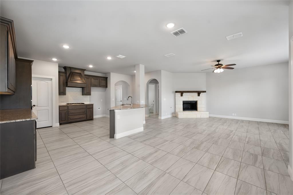 Standing in the dining area looking to the open kitchen and family room layout
