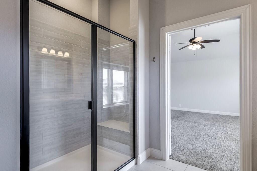 The Primary Bathroom upstairs features an oversized shower.