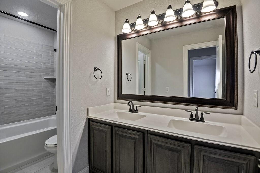 This is a full bathroom upstairs - one room separated into 2 private spaces by a door.