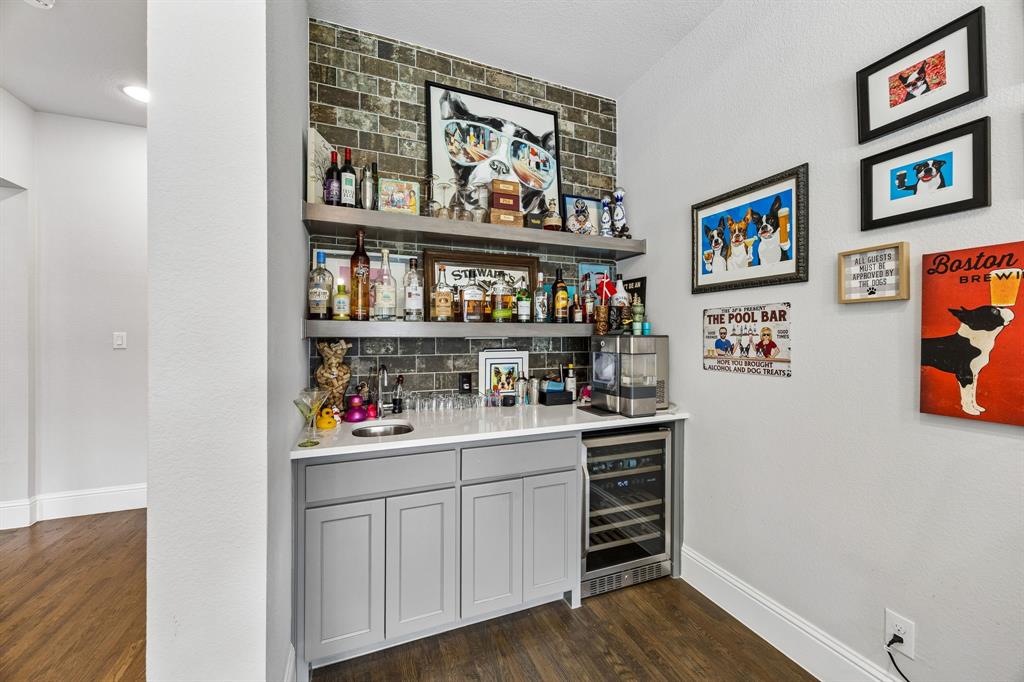 Wet bar with built in wine cooler in second living room.