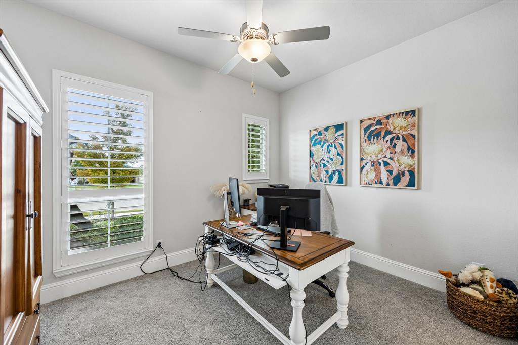 One of the 3 additional bedrooms. This one faces front and is used as an additional office now