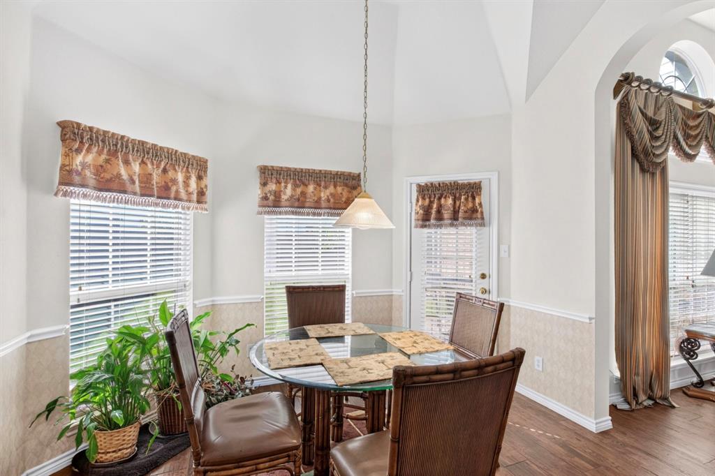 Window-lined breakfast nook beside the kitchen.