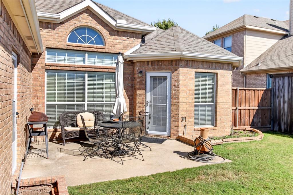 Patio off the main living spaces offers a place for outdoor seating.